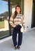 Nothing says cozy season quite like a classic striped sweater! This soft neutral knit is accented with timeless navy and burgundy stripes, creating the perfect color combination for fall. Exposed hems give it a relaxed, lived-in feel, while the ribbed neckline, cuffs, and hem add a polished finish. Whether you're headed to a football game, a weekend getaway, or simply enjoying a crisp autumn day, this cozy sweater is one you'll love reaching for.