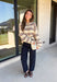 Nothing says cozy season quite like a classic striped sweater! This soft neutral knit is accented with timeless navy and burgundy stripes, creating the perfect color combination for fall. Exposed hems give it a relaxed, lived-in feel, while the ribbed neckline, cuffs, and hem add a polished finish. Whether you're headed to a football game, a weekend getaway, or simply enjoying a crisp autumn day, this cozy sweater is one you'll love reaching for.