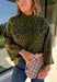 Bring a bold touch to your fall wardrobe with this cozy leopard sweater from Entro. Featuring a rich olive backdrop with a timeless leopard print, this effortlessly stylish knit is the perfect blend of classic and fun. The round neckline creates an easy, everyday silhouette, while the soft, cozy knit keeps you warm and comfortable on crisp autumn days. Whether you're headed to brunch, running errands, or enjoying a weekend getaway, this sweater is an easy favorite you'll wear on repeat.
