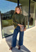 Bring a bold touch to your fall wardrobe with this cozy leopard sweater from Entro. Featuring a rich olive backdrop with a timeless leopard print, this effortlessly stylish knit is the perfect blend of classic and fun. The round neckline creates an easy, everyday silhouette, while the soft, cozy knit keeps you warm and comfortable on crisp autumn days. Whether you're headed to brunch, running errands, or enjoying a weekend getaway, this sweater is an easy favorite you'll wear on repeat.