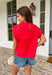 This red short sleeve top is the perfect pop of color for spring days ahead. Designed with neutral embroidery along the top, it brings just the right amount of contrast and charm. The lace sleeves add a soft, feminine touch, while the scalloped lace neckline gives it a beautifully detailed finish. Ladder trim detailing across the top adds texture and dimension, and the keyhole closure in the back completes the look with a subtle, polished detail. 