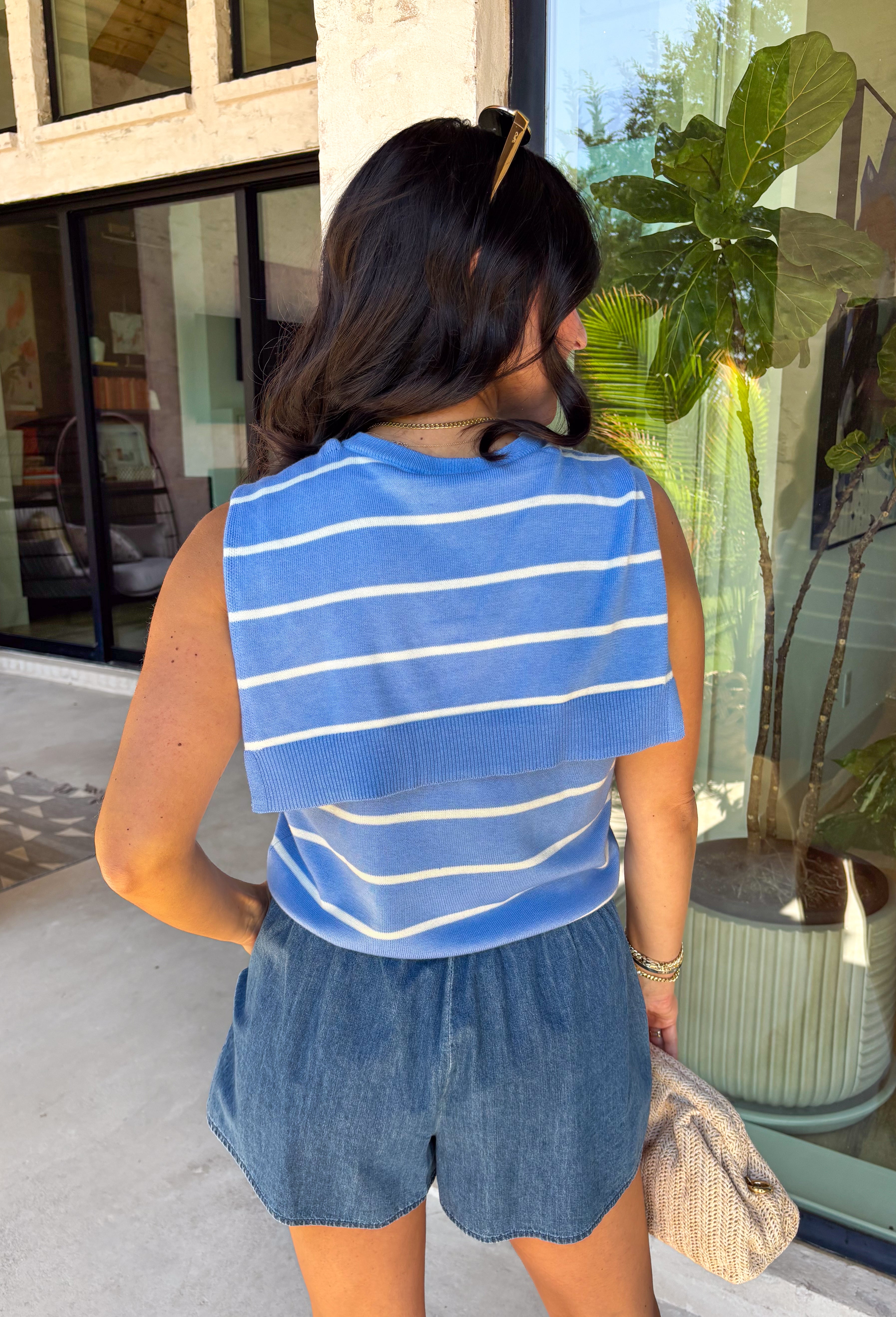 This light blue striped sweater tank with an attached scarf detail is such a chic, elevated piece for summer. The soft knit feel keeps it lightweight and breathable, while the built-in layered look adds that effortless, styled look without any extra effort. The white stripe print gives it a fresh, coastal vibe that’s perfect for everything from brunch to vacation dinners. It’s one of those pieces that instantly makes your outfit feel a little more put together. 