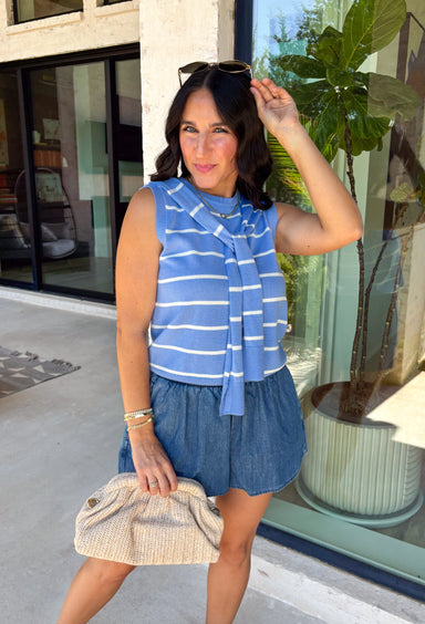 This light blue striped sweater tank with an attached scarf detail is such a chic, elevated piece for summer. The soft knit feel keeps it lightweight and breathable, while the built-in layered look adds that effortless, styled look without any extra effort. The white stripe print gives it a fresh, coastal vibe that’s perfect for everything from brunch to vacation dinners. It’s one of those pieces that instantly makes your outfit feel a little more put together. 