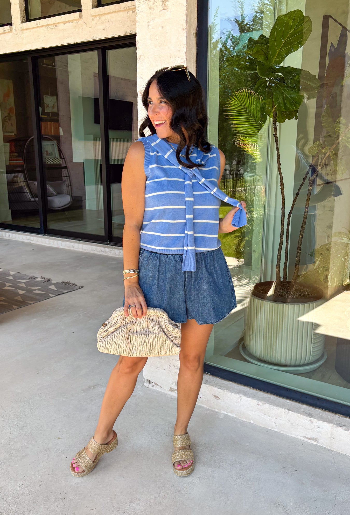 This light blue striped sweater tank with an attached scarf detail is such a chic, elevated piece for summer. The soft knit feel keeps it lightweight and breathable, while the built-in layered look adds that effortless, styled look without any extra effort. The white stripe print gives it a fresh, coastal vibe that’s perfect for everything from brunch to vacation dinners. It’s one of those pieces that instantly makes your outfit feel a little more put together. 