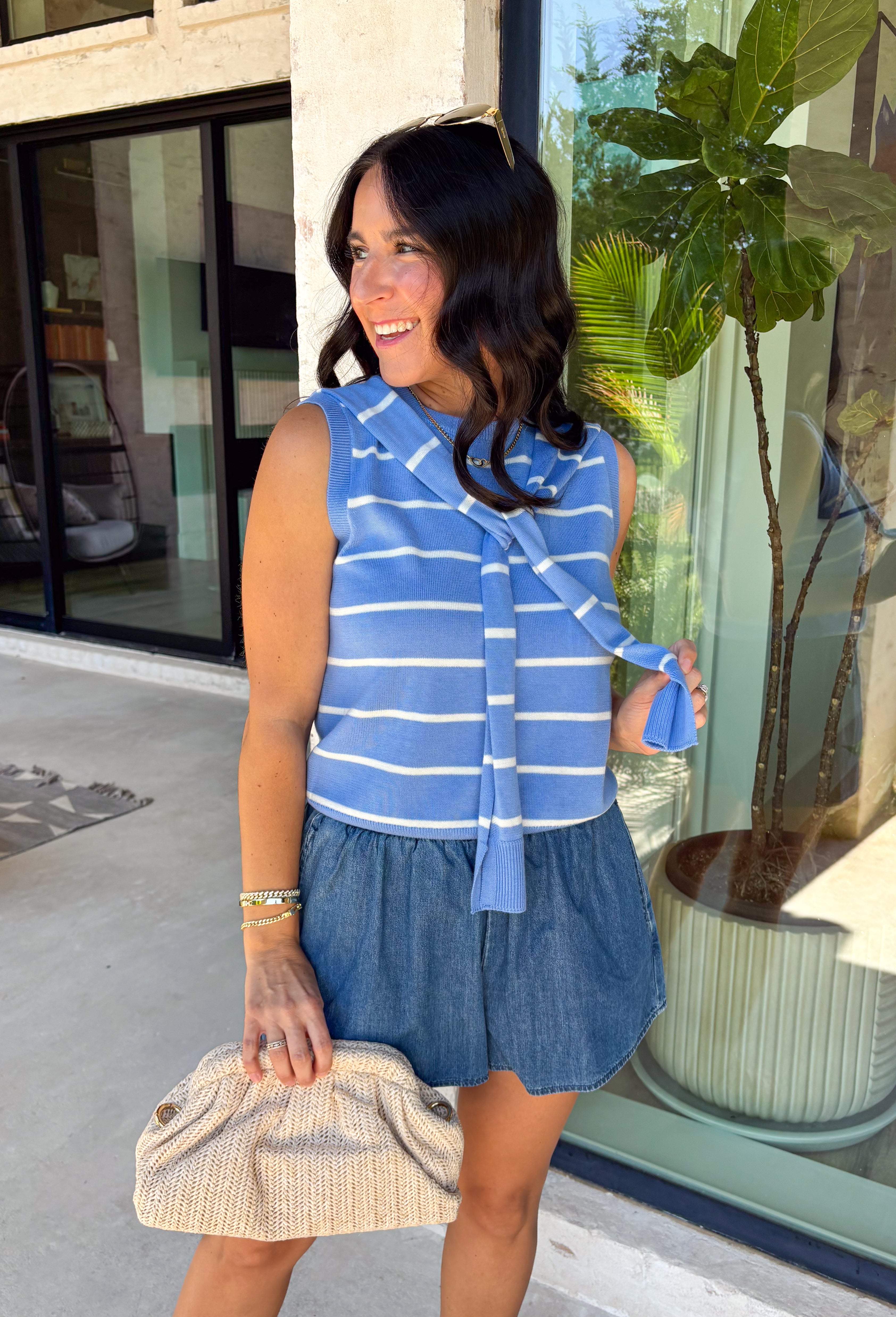 This light blue striped sweater tank with an attached scarf detail is such a chic, elevated piece for summer. The soft knit feel keeps it lightweight and breathable, while the built-in layered look adds that effortless, styled look without any extra effort. The white stripe print gives it a fresh, coastal vibe that’s perfect for everything from brunch to vacation dinners. It’s one of those pieces that instantly makes your outfit feel a little more put together. 