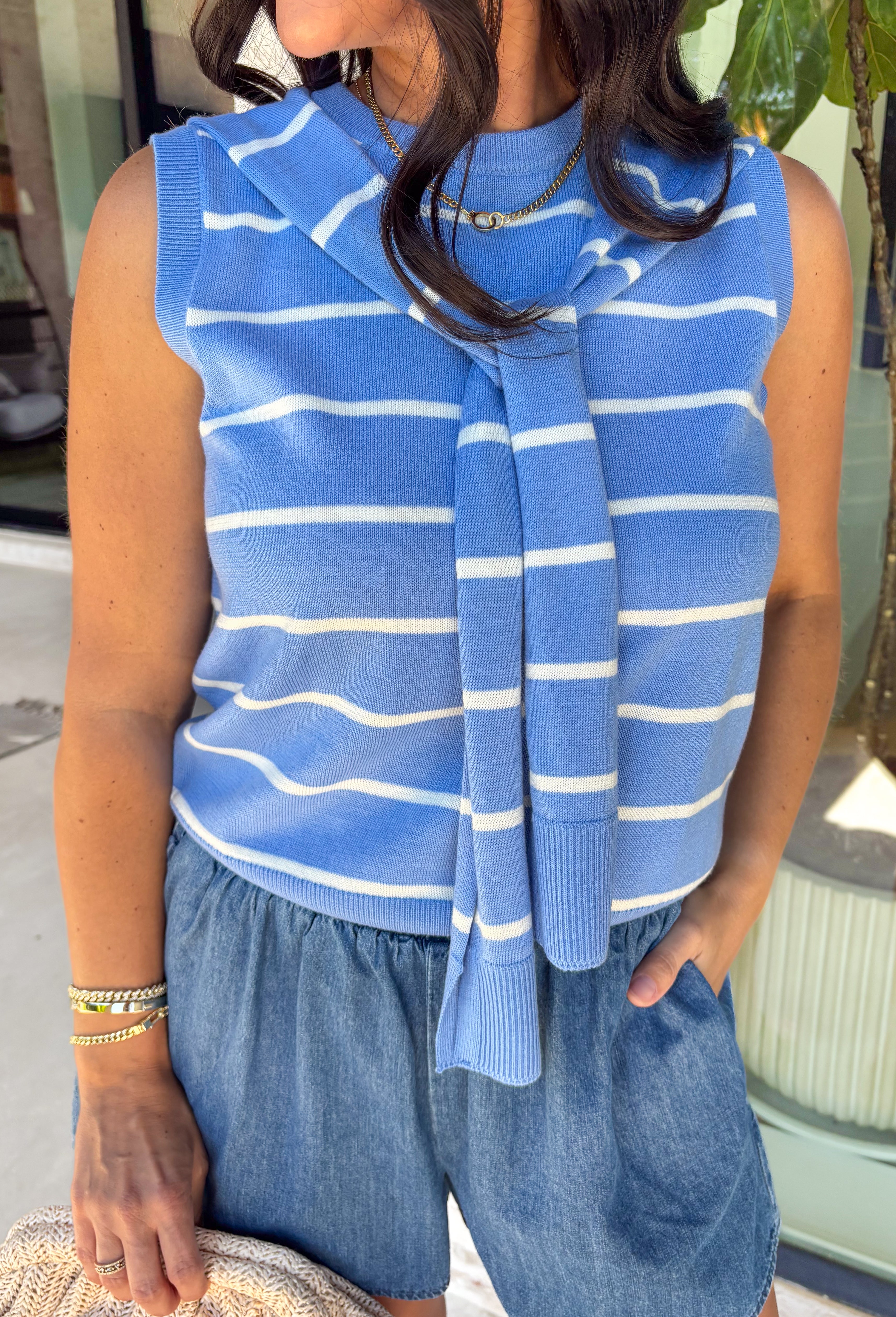 This light blue striped sweater tank with an attached scarf detail is such a chic, elevated piece for summer. The soft knit feel keeps it lightweight and breathable, while the built-in layered look adds that effortless, styled look without any extra effort. The white stripe print gives it a fresh, coastal vibe that’s perfect for everything from brunch to vacation dinners. It’s one of those pieces that instantly makes your outfit feel a little more put together. 