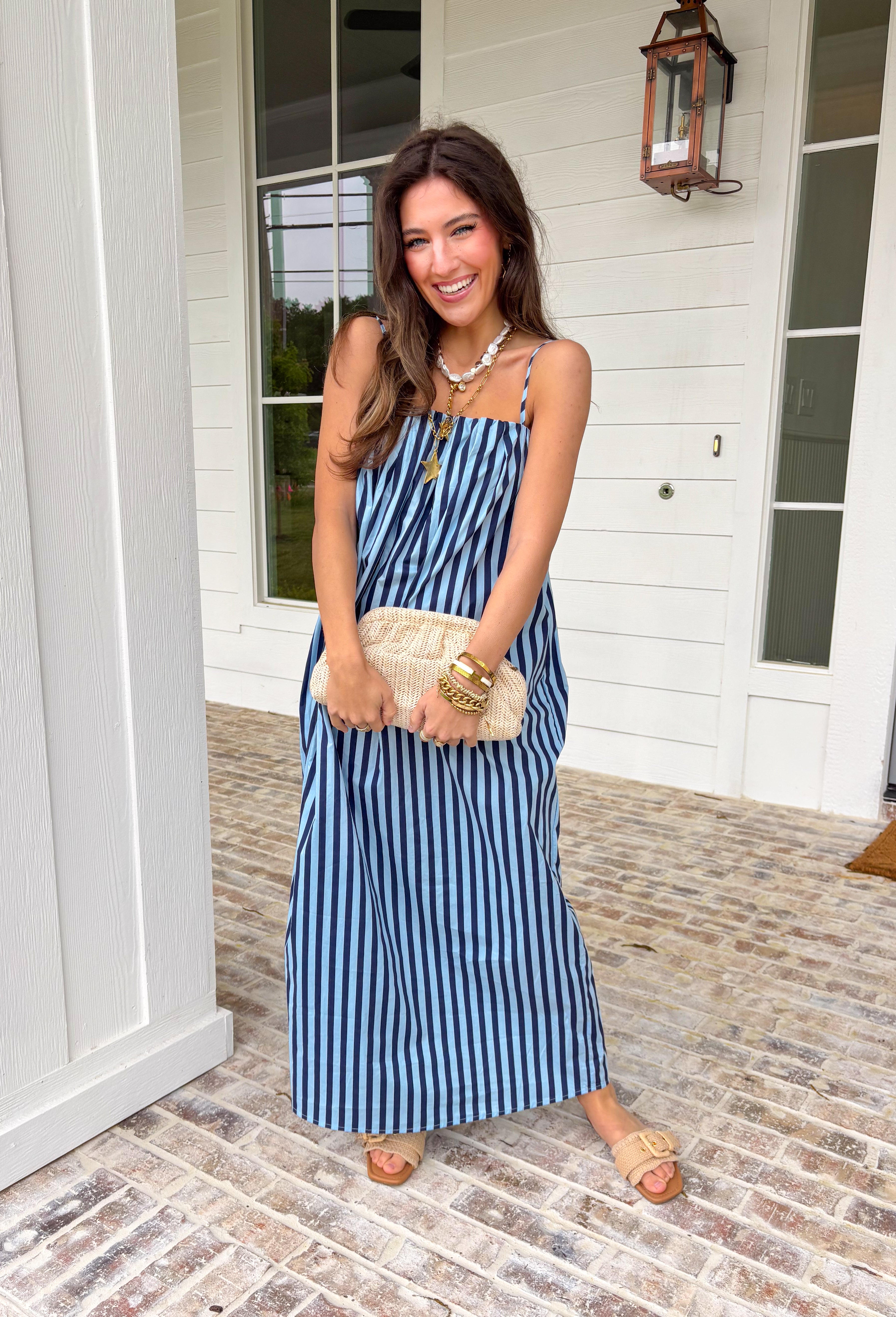 This light blue and navy stripe midi dress is giving easy, breezy spring days in the best way! Made from 100% cotton, it’s lightweight, breathable, and perfect for everything on your calendar—from weekend outings to casual dinners. The square neckline with elastic detail and adjustable straps create a flattering, customizable fit, while the midi length keeps it effortlessly polished. And yes… it has pockets (we know that matters!). Just add sandals or sneakers and you’re set for the day.