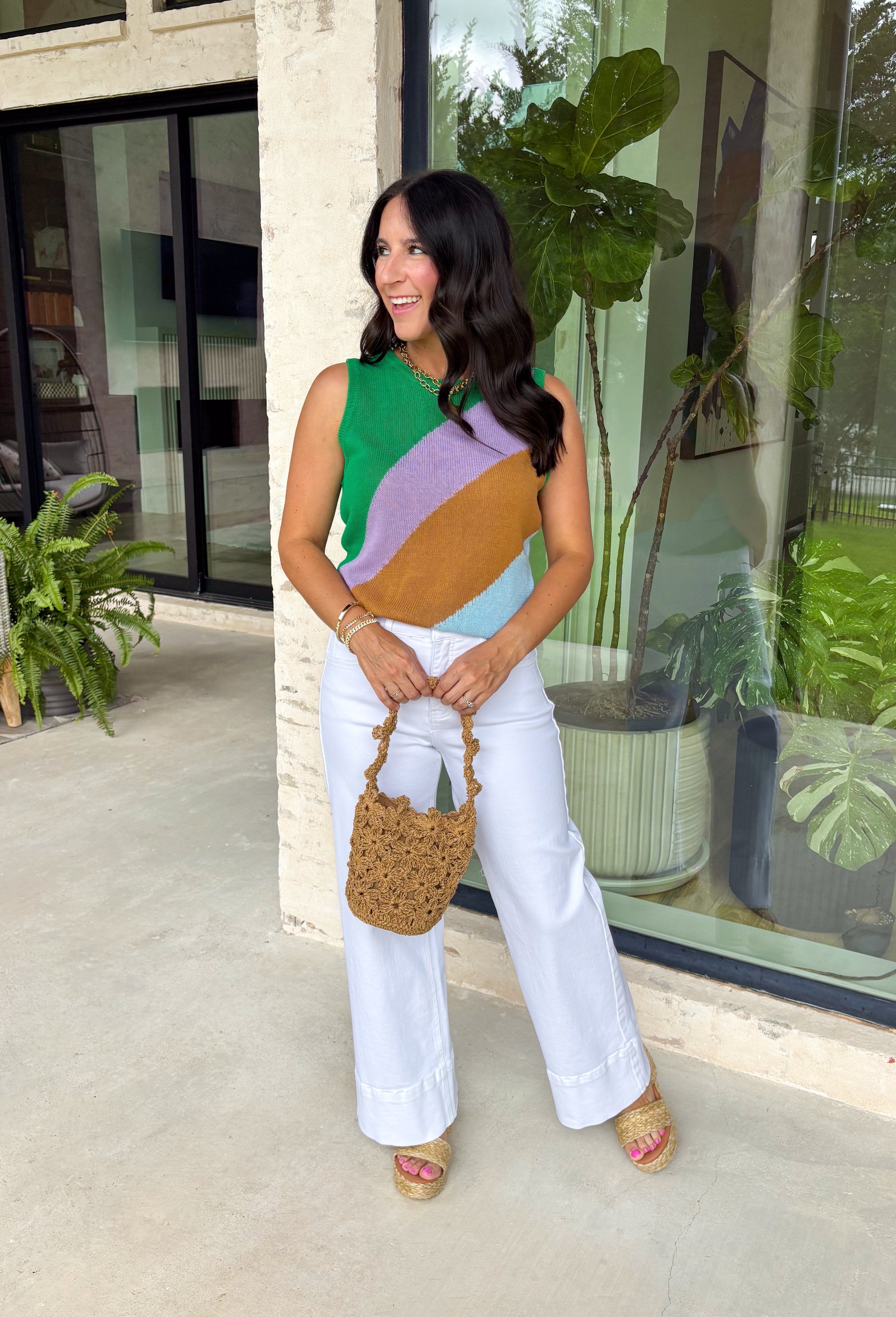 This lightweight knit sweater tank is the perfect mix of cozy and colorful for summer! Featuring a fun color block design in green, purple, brown, and light blue, it adds just the right pop while still feeling easy to style. The soft knit texture keeps it comfortable and breathable, making it great for warm days and cool evenings. It’s one of those effortless pieces that instantly makes your outfit feel styled—just pair it with denim or shorts and go. 