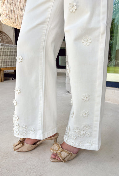 These cream wide leg jeans are what spring outfit dreams are made of! Designed with flattering tummy control and the prettiest monochromatic textured floral print, they bring just the right amount of feminine detail while still feeling easy and wearable. The pearl-centered blooms add such a special touch—like a little surprise moment that sets these apart from your everyday denim. With a comfortable stretch and breezy wide leg fit, they’re perfect for everything from brunch dates to weekend plans. 