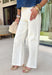 These cream wide leg jeans are what spring outfit dreams are made of! Designed with flattering tummy control and the prettiest monochromatic textured floral print, they bring just the right amount of feminine detail while still feeling easy and wearable. The pearl-centered blooms add such a special touch—like a little surprise moment that sets these apart from your everyday denim. With a comfortable stretch and breezy wide leg fit, they’re perfect for everything from brunch dates to weekend plans. 