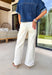 These cream wide leg jeans are what spring outfit dreams are made of! Designed with flattering tummy control and the prettiest monochromatic textured floral print, they bring just the right amount of feminine detail while still feeling easy and wearable. The pearl-centered blooms add such a special touch—like a little surprise moment that sets these apart from your everyday denim. With a comfortable stretch and breezy wide leg fit, they’re perfect for everything from brunch dates to weekend plans. 