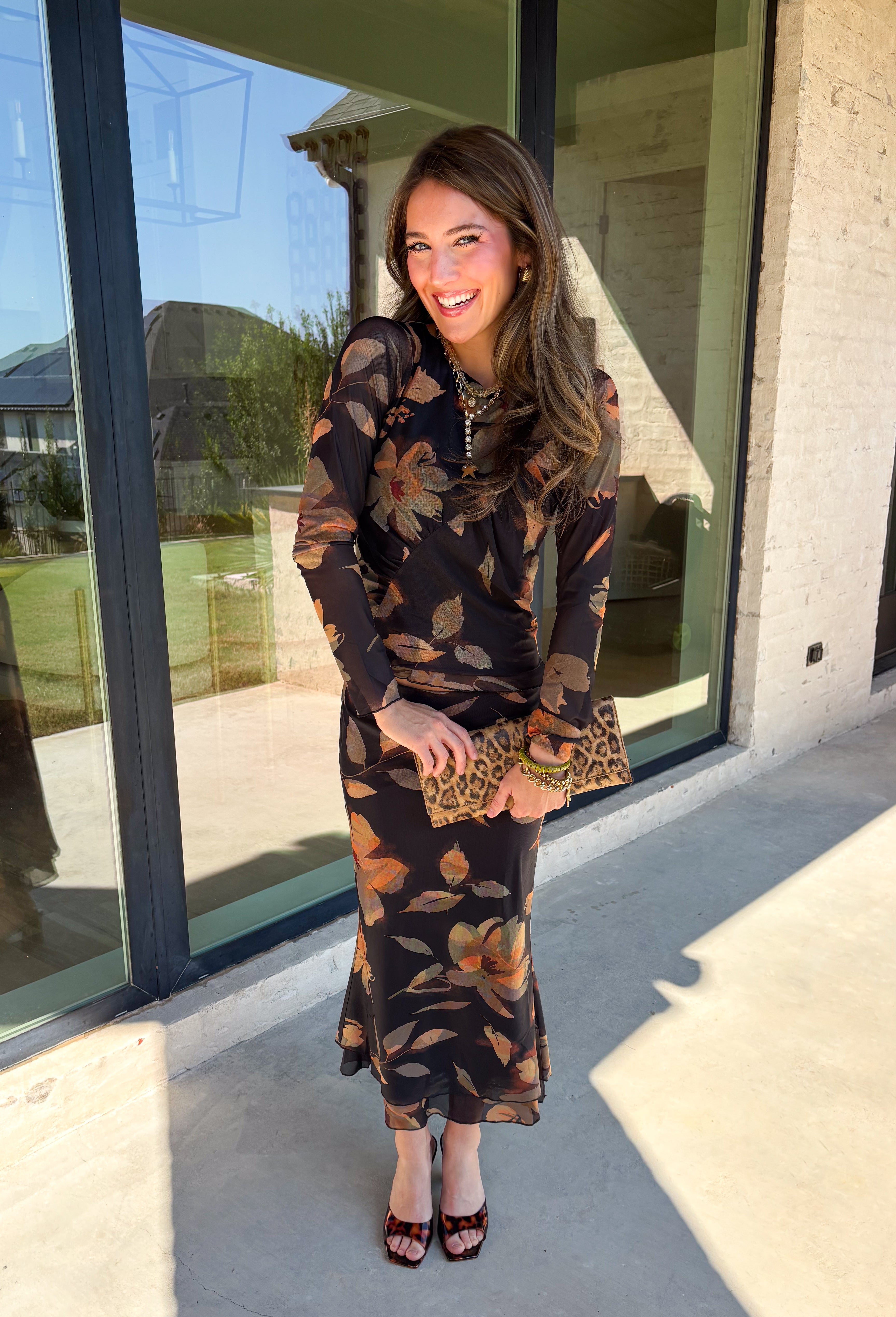 Effortlessly elegant and endlessly versatile, this matching set from Hyfve is a standout for the season. Featuring a black backdrop with a beautiful neutral floral print in muted shades of orange and olive, this two-piece outfit offers a timeless look you'll love wearing together or mixing and matching with other favorites in your wardrobe.