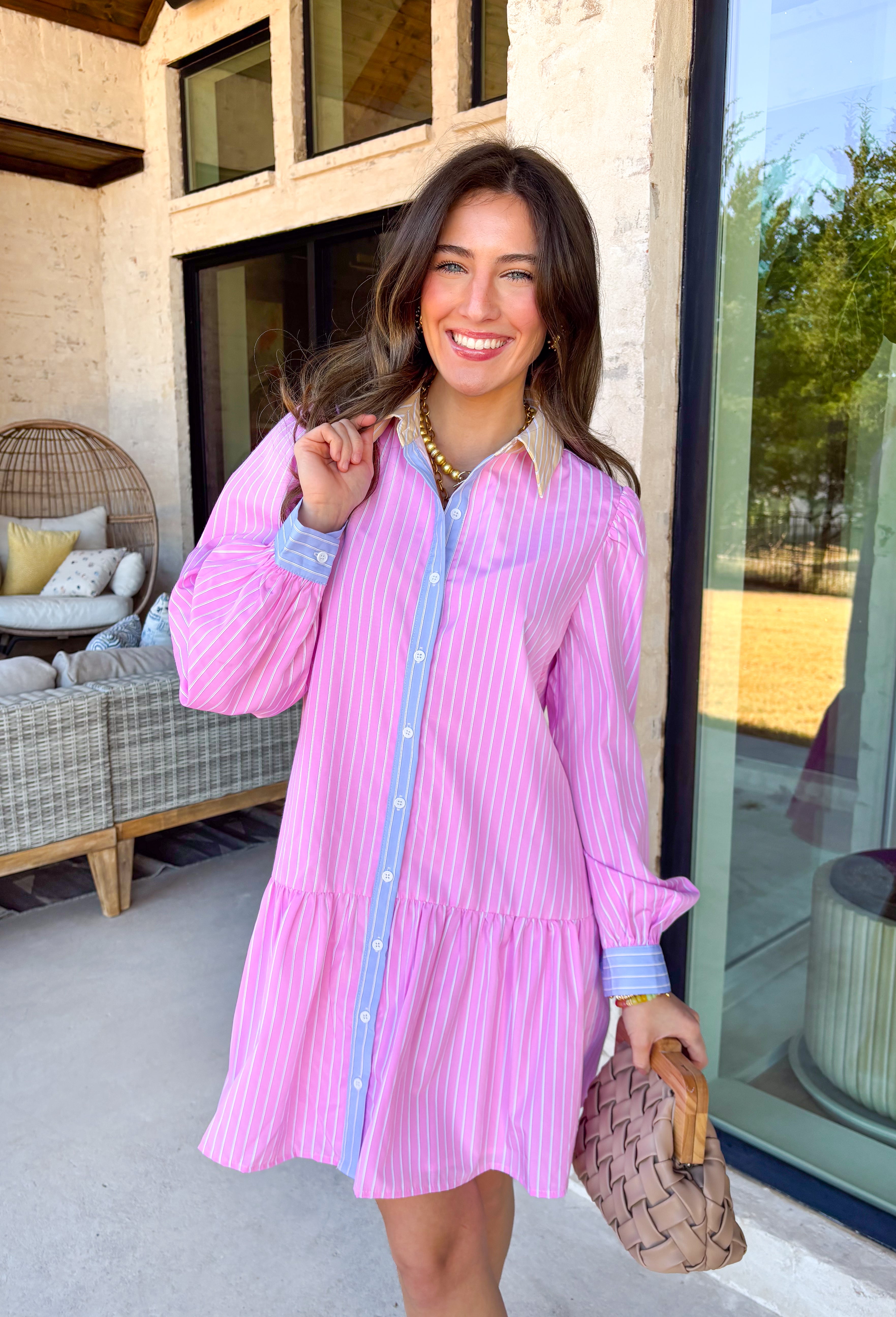 This light pink button down shirt dress by Fate is giving all the sweet spring vibes with a playful twist! Featuring a crisp white stripe print throughout, it has that classic, polished look—but the pastel details make it feel extra special. The butter yellow and white striped collar adds a fun pop, while the light blue trim running down the button front and along the cuffs gives it the cutest contrast that totally sets it apart from your average shirt dress. 