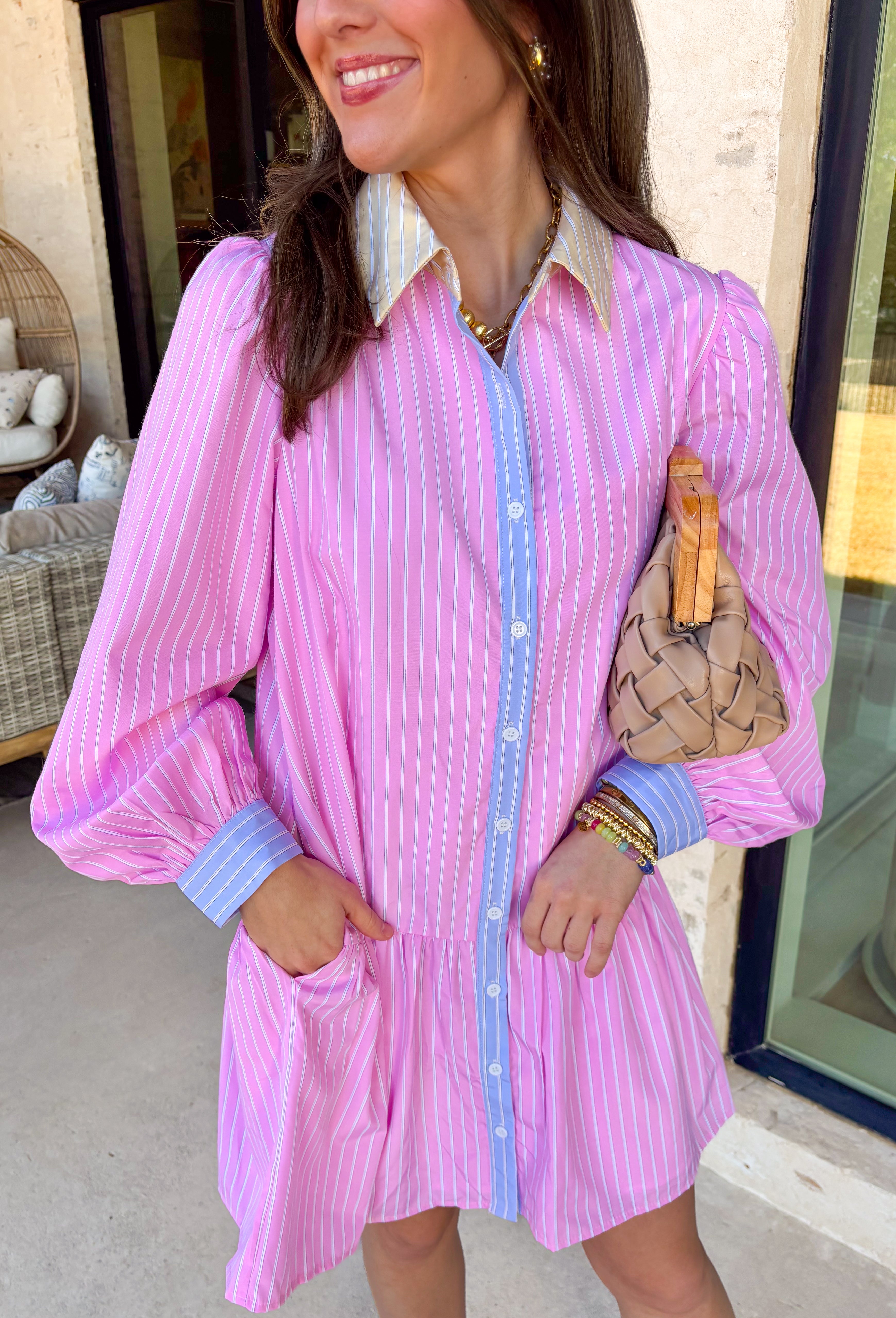 This light pink button down shirt dress by Fate is giving all the sweet spring vibes with a playful twist! Featuring a crisp white stripe print throughout, it has that classic, polished look—but the pastel details make it feel extra special. The butter yellow and white striped collar adds a fun pop, while the light blue trim running down the button front and along the cuffs gives it the cutest contrast that totally sets it apart from your average shirt dress. 