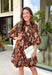 Capture the beauty of the season in this effortlessly feminine dress from Entro. Designed with a rich brown backdrop and a fall-inspired floral print with delicate leaf-like details, this charming dress is perfect for everything from brunch dates to seasonal celebrations. The flattering v-neckline features sweet tie details at the neck and bust, while decorative front buttons add timeless appeal. 