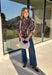 Neutral gets a little wild with this brown and cream zebra print blouse from Entro. The warm color combination makes the statement print easy to style while fitting perfectly into the transition from fall into winter. A stand collar and partial button-front closure give the lightweight silhouette a classic touch, while gathered detailing at the shoulders and back adds shape and movement.