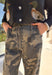 Keep it cool and casual with these wide leg camo pants by Mustard Seed. Designed with a relaxed silhouette and a lightweight feel, these pants feature an elastic waistband with a front tie detail for added comfort and style. The camo print gives them a trendy edge, making them perfect for all season long.