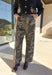 Keep it cool and casual with these wide leg camo pants by Mustard Seed. Designed with a relaxed silhouette and a lightweight feel, these pants feature an elastic waistband with a front tie detail for added comfort and style. The camo print gives them a trendy edge, making them perfect for all season long.