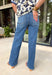 A pair of dark wash jeans is a wardrobe essential, and this style checks all the boxes! The rich dark wash gives these jeans a polished, elevated look, while the wide leg silhouette keeps them effortlessly on trend. Designed with a comfortable mid-rise fit and just the right amount of stretch, they're perfect for everything from workdays to weekend plans. Easy to dress up or down, these versatile jeans pair beautifully with cozy sweaters, tailored blouses, graphic tees, and everything in between. 