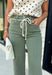 Meet the jeans that will instantly elevate your everyday wardrobe. Designed in a versatile olive wash, these wide leg jeans offer the perfect blend of comfort and effortless style. The removable self-tie waist lets you customize your look, whether you prefer a feminine bow or a clean, classic finish without it. Easy to dress up or down, they're the perfect pair for everything from busy weekdays to weekend brunch, fall festivals, and coffee dates.
