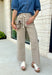 Meet the jeans that will instantly elevate your everyday wardrobe. Designed in a versatile taupe wash, these wide leg jeans offer the perfect blend of comfort and effortless style. The removable self-tie waist lets you customize your look, whether you prefer a feminine bow or a clean, classic finish without it. Easy to dress up or down, they're the perfect pair for everything from busy weekdays to weekend brunch, fall festivals, and coffee dates.
