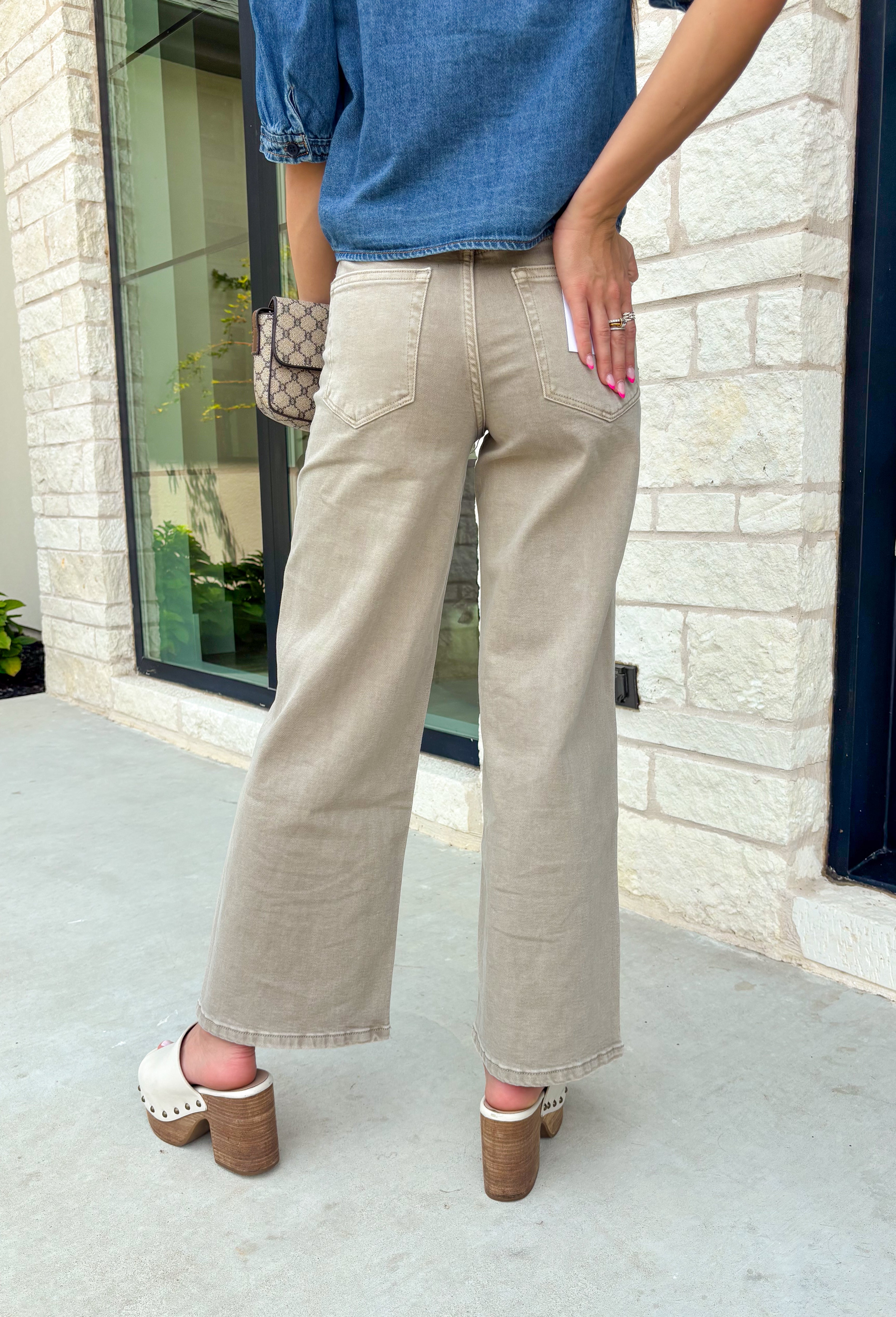 Meet the jeans that will instantly elevate your everyday wardrobe. Designed in a versatile taupe wash, these wide leg jeans offer the perfect blend of comfort and effortless style. The removable self-tie waist lets you customize your look, whether you prefer a feminine bow or a clean, classic finish without it. Easy to dress up or down, they're the perfect pair for everything from busy weekdays to weekend brunch, fall festivals, and coffee dates.