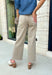 Meet the jeans that will instantly elevate your everyday wardrobe. Designed in a versatile taupe wash, these wide leg jeans offer the perfect blend of comfort and effortless style. The removable self-tie waist lets you customize your look, whether you prefer a feminine bow or a clean, classic finish without it. Easy to dress up or down, they're the perfect pair for everything from busy weekdays to weekend brunch, fall festivals, and coffee dates.