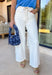 Nothing says fresh season energy like a crisp pair of white denim, and these wide leg jeans by Vervet are exactly the kind of staple you’ll build outfits around on repeat. The classic wide leg silhouette feels easy and flattering, while the removable self-tie waist adds a fun little detail that makes your look feel instantly styled (even when you’re keeping it simple). Dress them up with a blouse and wedges or keep it casual with a tank and sneakers—either way, they’re a spring must-have.