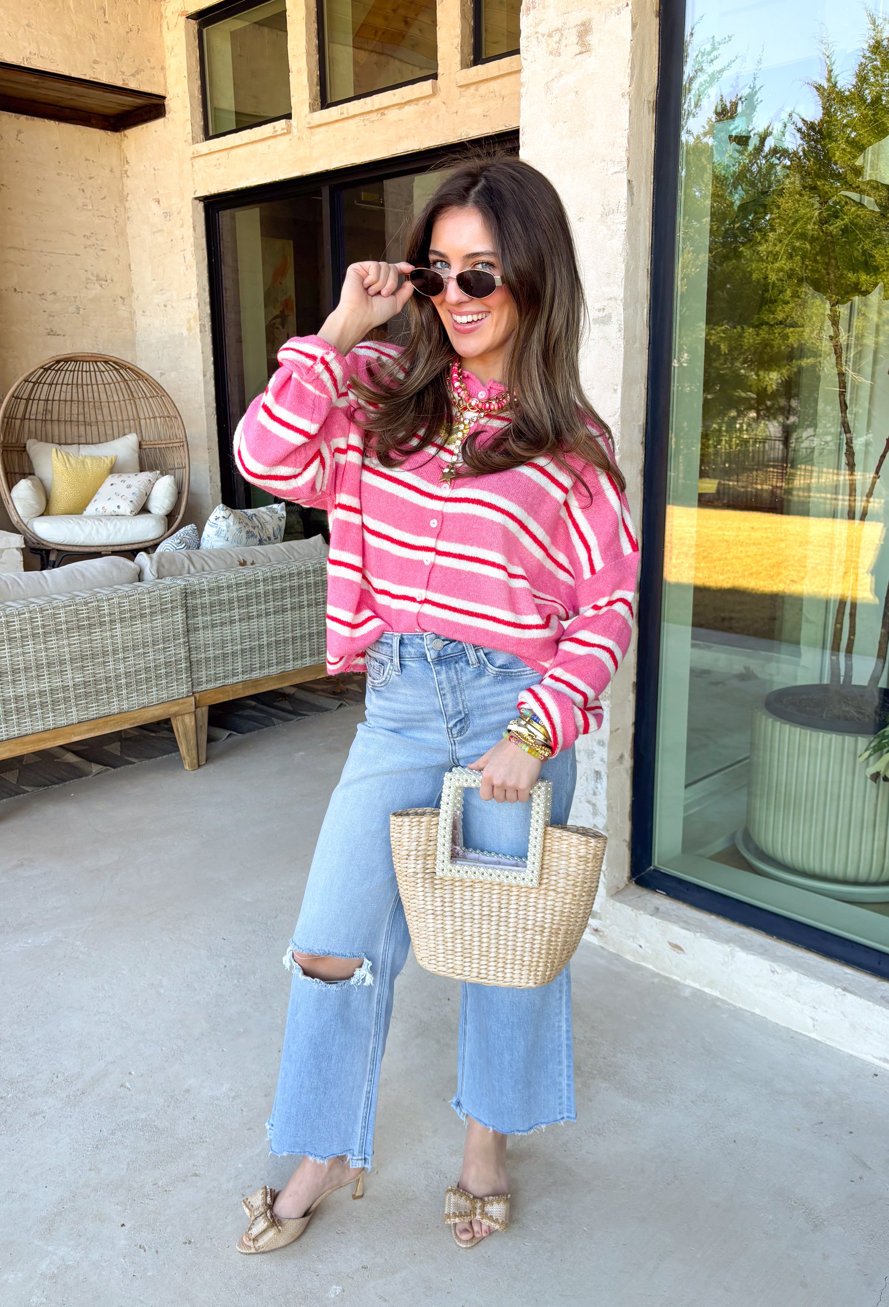 Add a pop of happy to your spring layers with this pink, red, and white striped button down cardigan! Soft, cozy, and easy to throw on, it’s the kind of knit that instantly makes your outfit feel more fun (even if you’re just running out for coffee). Wear it buttoned up as a top or left open over a tank for that effortless, “cute but comfy” vibe.