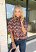 Soft, feminine, and full of seasonal charm, this floral blouse is an effortless addition to your fall wardrobe. Designed with a beautiful blush backdrop and a rich burgundy and tan floral print, this top brings together warm autumn hues in a timeless silhouette. The button-front design adds classic appeal, while the ruffle hem creates a flattering, feminine finish. Gathered detailing at the back yoke gives this blouse a relaxed, flowy fit that's perfect for everything from workdays to weekend outings.