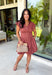 Easy, timeless, and effortlessly flattering, this clay dress is ready for all your favorite fall moments! The warm clay hue pairs beautifully with the season, while the v-neckline and button front create a classic, polished look. Gathered detailing at the waist and a smocked back offer a comfortable, figure-flattering fit you'll love wearing from day to night. 