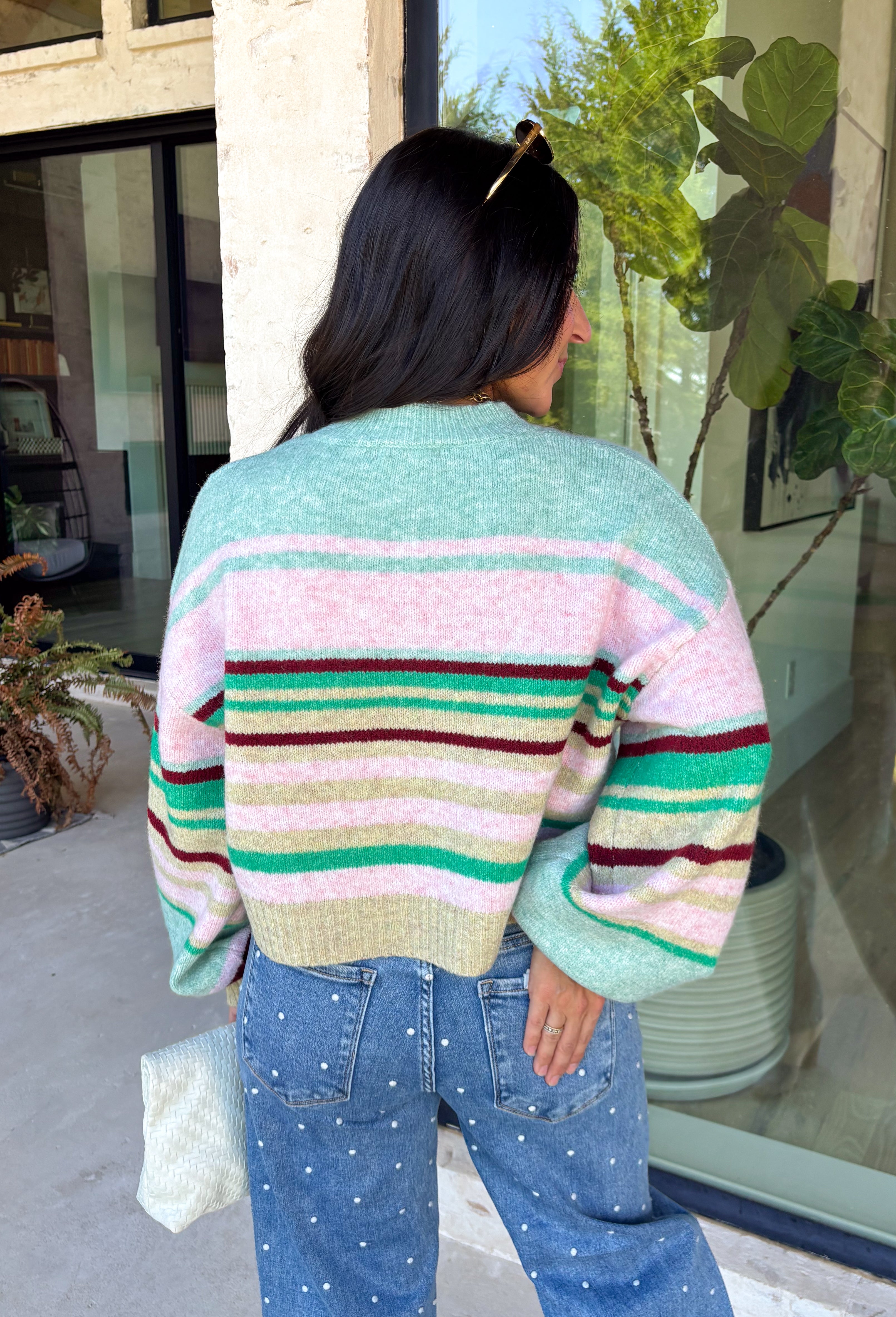 Brighten up chilly days with this irresistibly cozy sweater from Hyfve. Featuring a beautiful stripe pattern in sea foam, light pink, green, tan, and burgundy, this soft knit brings the perfect mix of playful color and timeless fall style. The mock neckline adds a cozy touch for cooler weather, while the ribbed neckline, cuffs, and hem create a polished finish. 