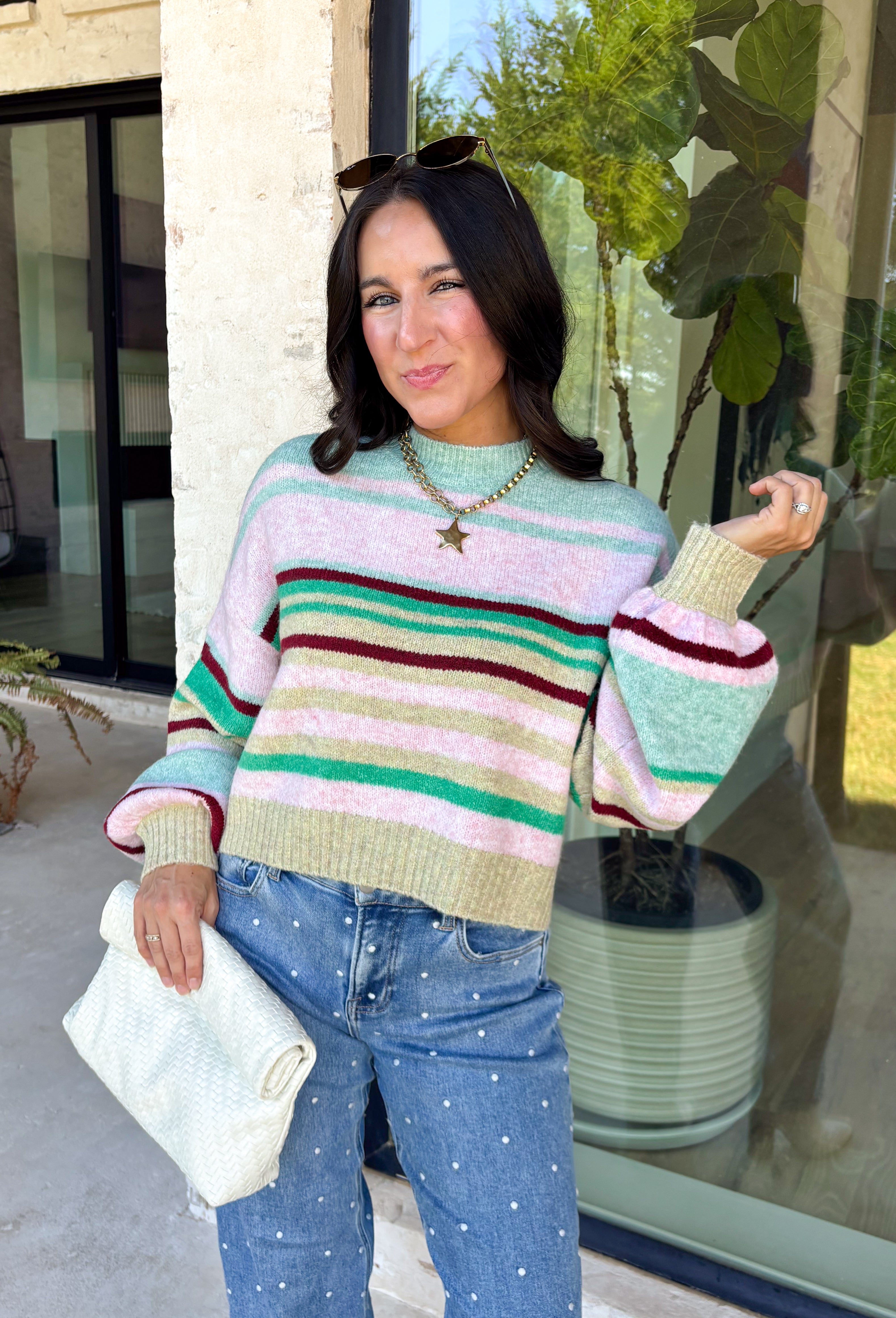 Brighten up chilly days with this irresistibly cozy sweater from Hyfve. Featuring a beautiful stripe pattern in sea foam, light pink, green, tan, and burgundy, this soft knit brings the perfect mix of playful color and timeless fall style. The mock neckline adds a cozy touch for cooler weather, while the ribbed neckline, cuffs, and hem create a polished finish. 