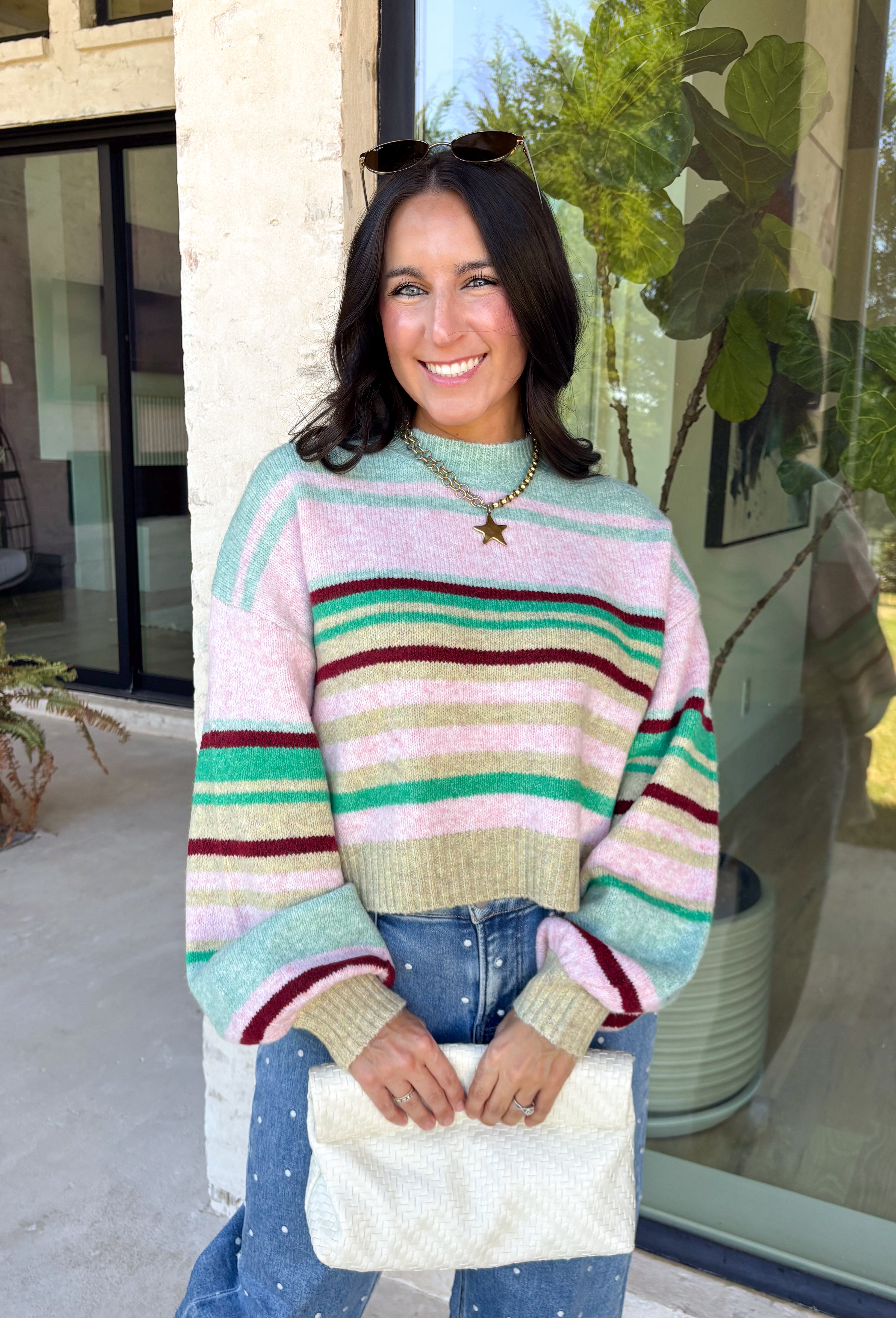 Brighten up chilly days with this irresistibly cozy sweater from Hyfve. Featuring a beautiful stripe pattern in sea foam, light pink, green, tan, and burgundy, this soft knit brings the perfect mix of playful color and timeless fall style. The mock neckline adds a cozy touch for cooler weather, while the ribbed neckline, cuffs, and hem create a polished finish. 