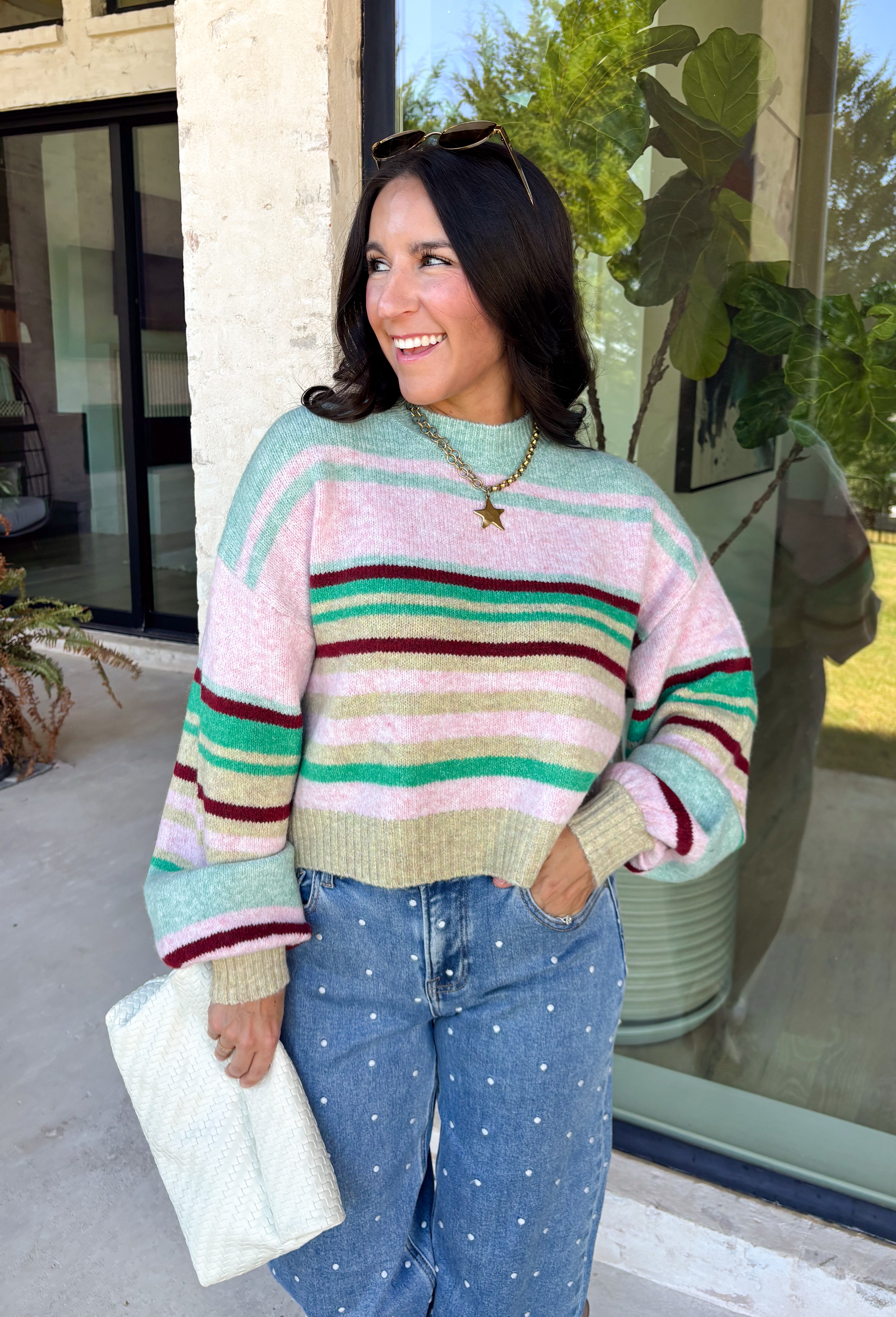 Brighten up chilly days with this irresistibly cozy sweater from Hyfve. Featuring a beautiful stripe pattern in sea foam, light pink, green, tan, and burgundy, this soft knit brings the perfect mix of playful color and timeless fall style. The mock neckline adds a cozy touch for cooler weather, while the ribbed neckline, cuffs, and hem create a polished finish. 