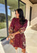 This burgundy button-down dress by Entro is a timeless piece with a fall-ready twist. Featuring a delicate floral print along the sides, it’s designed with a ruffled accent v-neckline for a touch of femininity. The elastic sleeves make for an easy, comfortable fit, while the full lining ensures effortless wear. With its rich color and flattering silhouette, this dress transitions seamlessly from day to night.