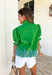This green embroidered top is giving all the charming, autumnal details you love. The short sleeves feature smocked cuffs for a soft, feminine touch, while the blue embroidered border hem adds a pop of color that makes the whole look stand out. The ruffle band collar with button closure keeps it sweet and polished, perfect for pairing with jeans or layering under a cardigan as the weather cools. Lightweight and easy to wear, it’s a piece you’ll reach for again and again this season.