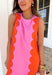 This pink sleeveless dress is serving up the sweetest pop of color with its tomato red scalloped color block design. The contrast detailing adds a playful, eye-catching touch while still keeping the silhouette clean and classic. Designed with an easy sleeveless cut and flattering shape, it’s perfect for warm days when you want something effortless but fun. A back zipper closure keeps the look sleek, and side pockets (yes, pockets!) make it as practical as it is cute.