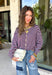 Rich fall colors come together beautifully in this cozy striped cardigan! Featuring burgundy and light blue stripes accented with warm tan trim, this timeless knit adds the perfect pop of seasonal color to any outfit. The button-down front offers endless styling options, while the ribbed neckline gives it a classic finish. Soft, lightweight, and easy to layer, this cardigan is perfect for everything from office days and coffee dates to football weekends and crisp autumn afternoons.