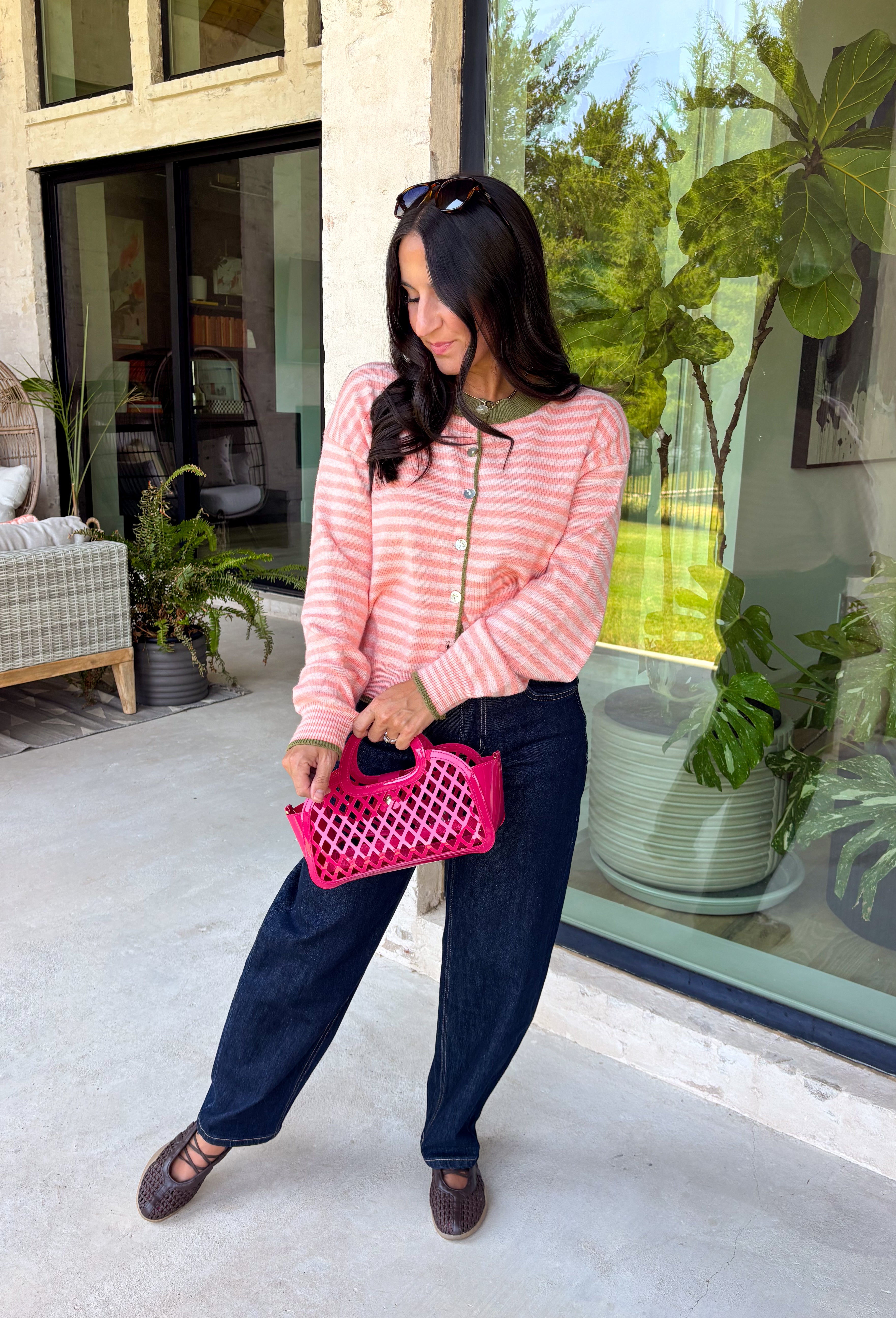 Bright colors come together beautifully in this cozy striped cardigan! Featuring pink and salmon stripes accented with an olive trim, this timeless knit adds the perfect pop of seasonal color to any outfit. The button-down front offers endless styling options, while the ribbed neckline gives it a classic finish. Soft, lightweight, and easy to layer, this cardigan is perfect for everything from office days and coffee dates to football weekends and crisp autumn afternoons.