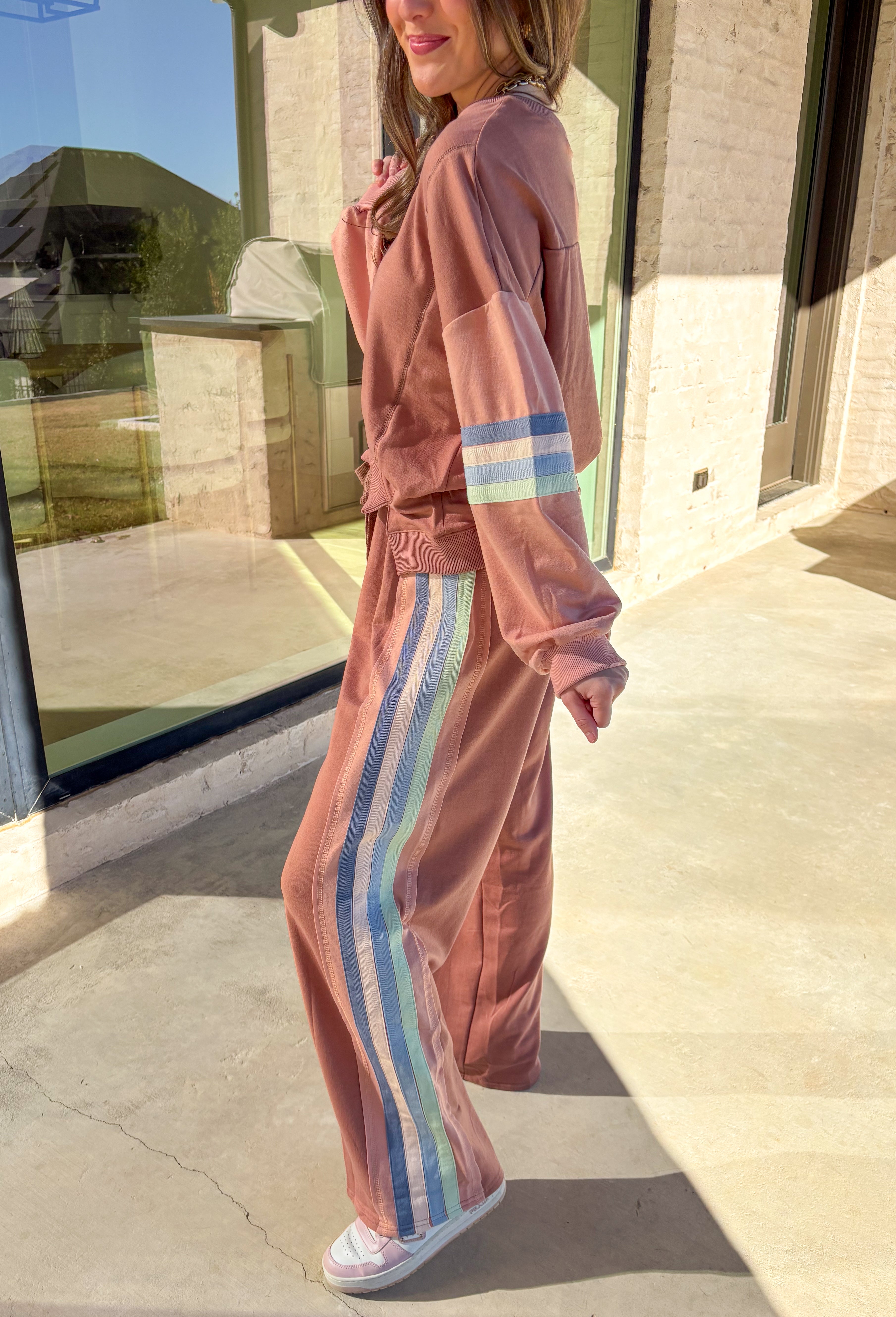 Brighten your spring wardrobe with this mauve two-piece set by New In. Designed with a soft, lightweight feel and a relaxed fit, this matching top and wide-leg pant combo is perfect for casual days and laid-back weekends. The blue, light mauve, and sage stripe detailing adds a cheerful pop of color, while the drawstring elastic waist keeps it comfy and easy to wear all day long.