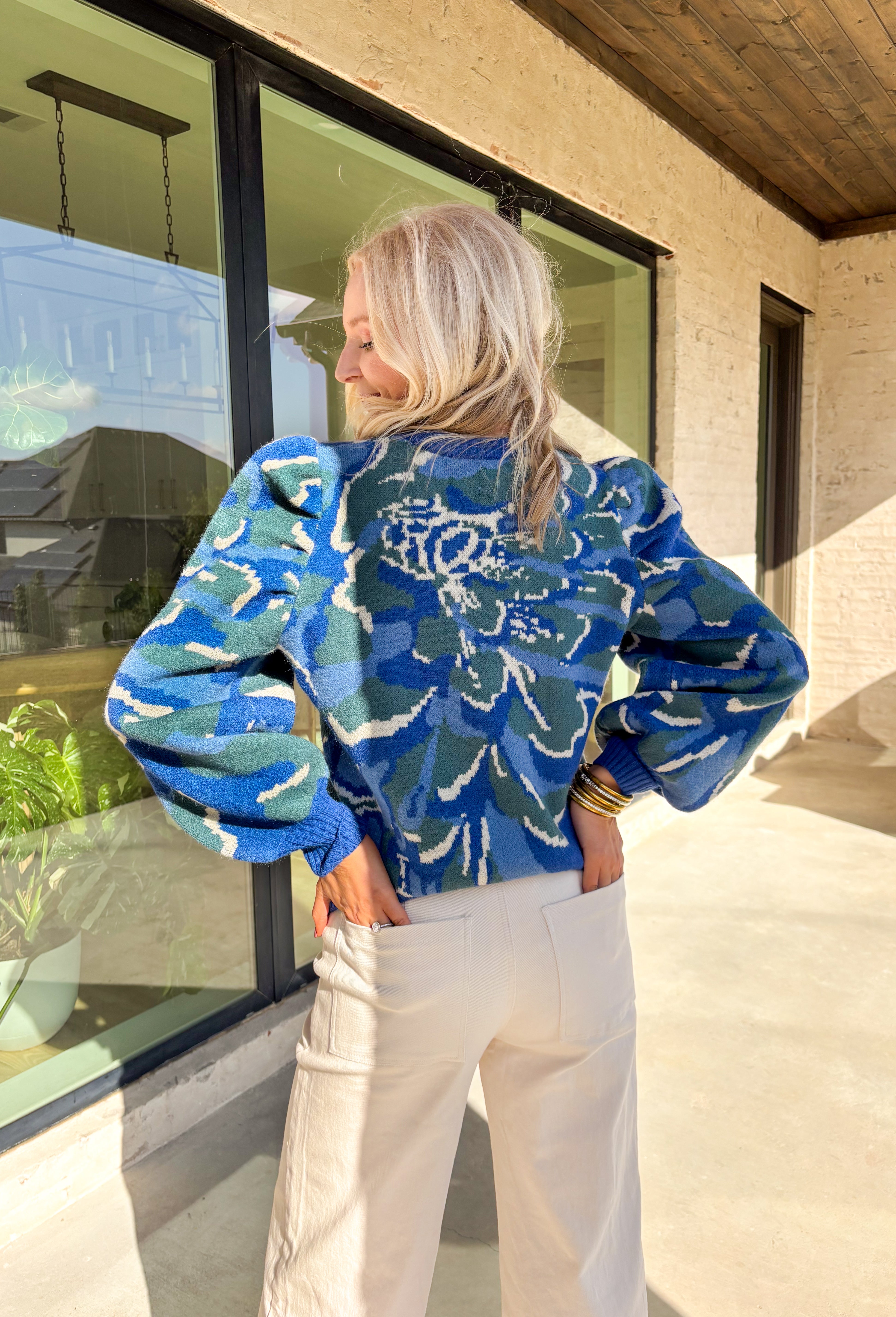 Add a touch of cozy color to your winter wardrobe with this soft knit sweater by Voy. Designed in a blue base with an abstract print in shades of green, blue, and off white, this piece brings warmth and personality to chilly days. The balloon sleeves add a stylish silhouette, while the plush knit makes it an instant favorite for the season.