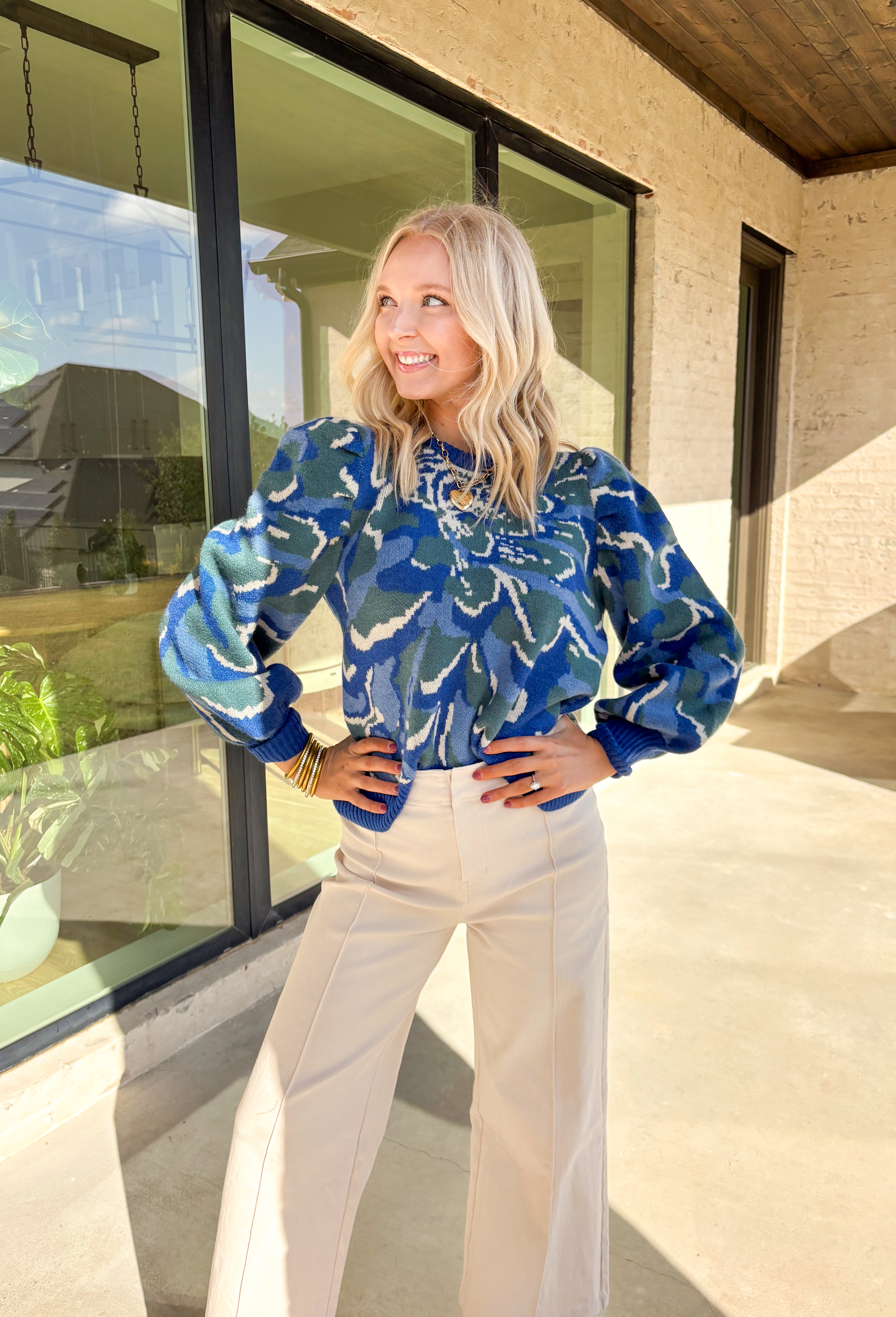Add a touch of cozy color to your winter wardrobe with this soft knit sweater by Voy. Designed in a blue base with an abstract print in shades of green, blue, and off white, this piece brings warmth and personality to chilly days. The balloon sleeves add a stylish silhouette, while the plush knit makes it an instant favorite for the season.