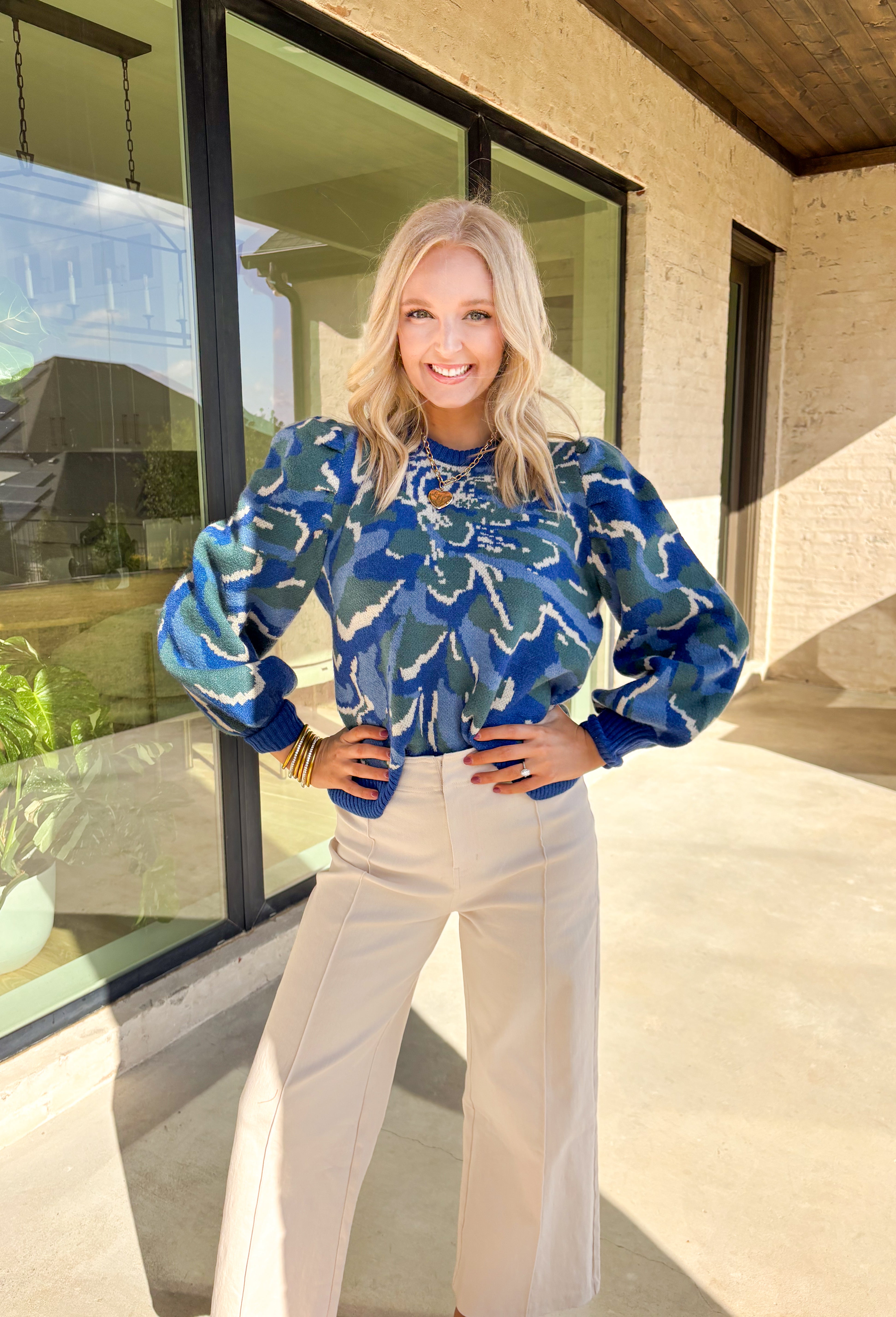 Add a touch of cozy color to your winter wardrobe with this soft knit sweater by Voy. Designed in a blue base with an abstract print in shades of green, blue, and off white, this piece brings warmth and personality to chilly days. The balloon sleeves add a stylish silhouette, while the plush knit makes it an instant favorite for the season.