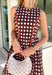 Classic polka dots never go out of style, and this charming midi dress from Entro is a timeless piece you'll wear for seasons to come. Designed with a rich brown backdrop and an off-white polka dot print, this sleeveless silhouette is effortlessly polished and easy to wear. Contrast piping adds a refined touch, while the back zipper creates a tailored fit. Finished with side pockets and a fully lined design, this cotton midi dress is perfect for everything.