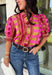 Bring playful pattern and timeless charm to your fall wardrobe with this beautifully detailed top from Entro. Featuring a unique mix of stripe and polka dot prints in rich shades of plum, magenta, and olive, this eye-catching blouse is perfect for adding personality to your everyday style. The feminine ruffle neckline and button-front design create a polished look, while the short puff sleeves are finished with smocked ruffle cuffs for an extra touch of charm. 