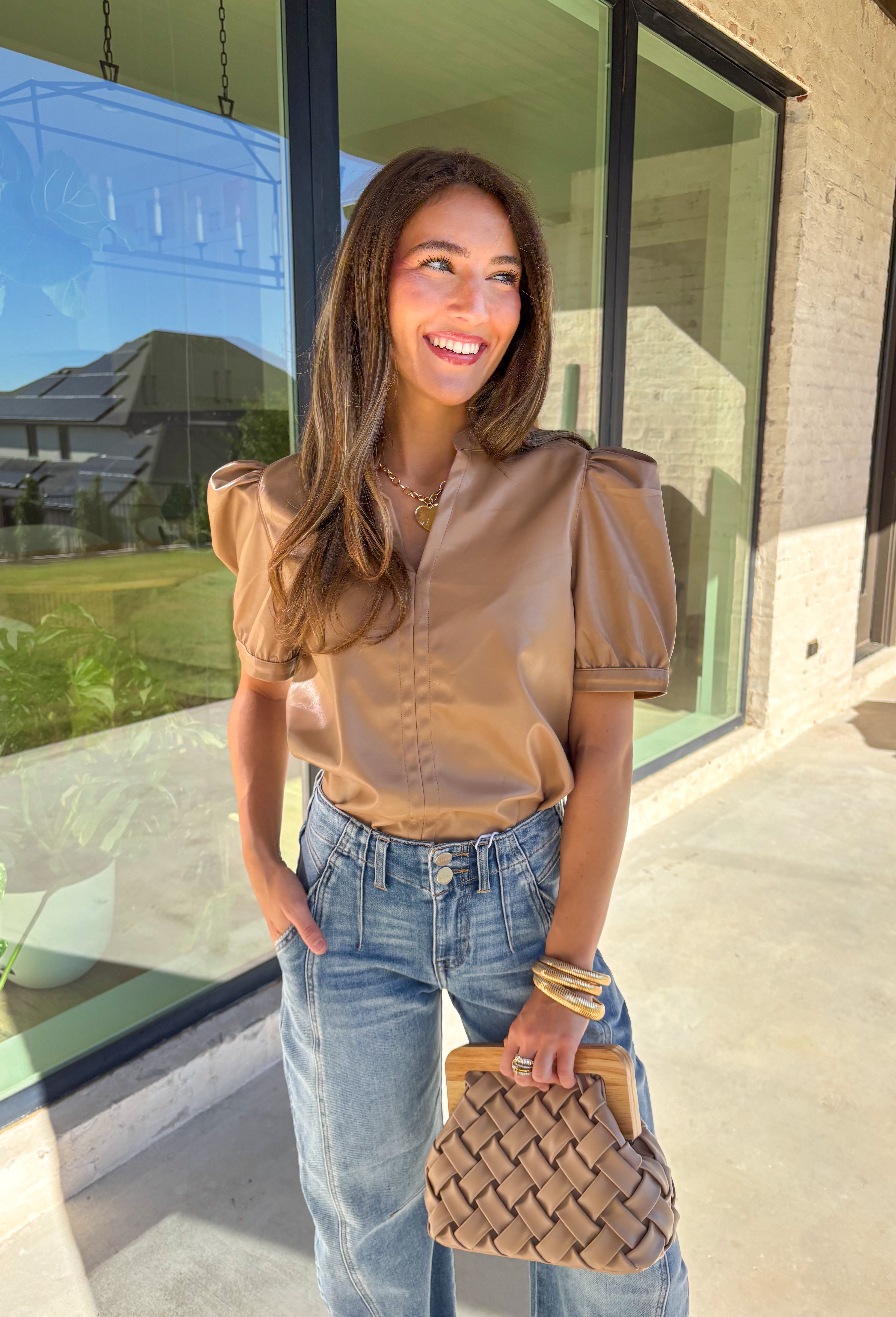 This light brown faux leather top by Fate is the perfect mix of sleek and modern. Designed with a flattering v-neckline and short sleeves, it adds a chic edge to any outfit while keeping your look polished and effortless. The buttery-soft faux leather gives it a touch of luxury, making it perfect for a night out or an elevated everyday style.