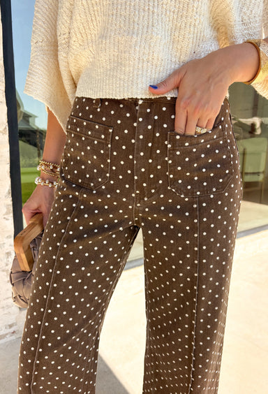 These wide leg pants from Entro are the perfect way to add a little personality to your everyday wardrobe. Designed in a rich brown denim with a classic white polka dot print, they offer a fun yet timeless look that's easy to style all season long. The flattering wide leg silhouette creates an effortlessly elevated feel, while the sturdy cotton denim and functional pockets make them as practical as they are stylish. 