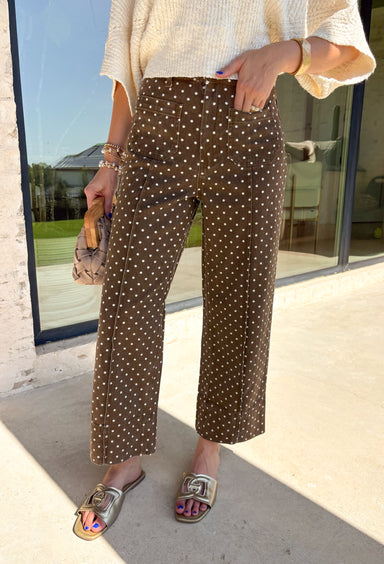These wide leg pants from Entro are the perfect way to add a little personality to your everyday wardrobe. Designed in a rich brown denim with a classic white polka dot print, they offer a fun yet timeless look that's easy to style all season long. The flattering wide leg silhouette creates an effortlessly elevated feel, while the sturdy cotton denim and functional pockets make them as practical as they are stylish. 
