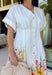Fresh, timeless, and full of spring color, this white button-down midi dress by Entro is an instant favorite. The clean white base keeps it classic, while the colorful floral print along the bottom adds the prettiest pop of color—featuring shades of orange, red, yellow, pink, blue, and green. Cuffed sleeves give it an easy, relaxed feel, and pleating detail along the front adds a flattering touch that elevates the whole look. 